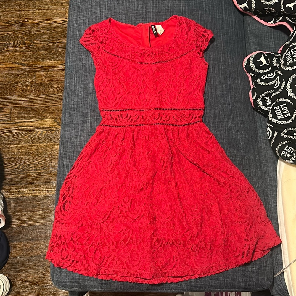 Red lace dress, right above knee length.